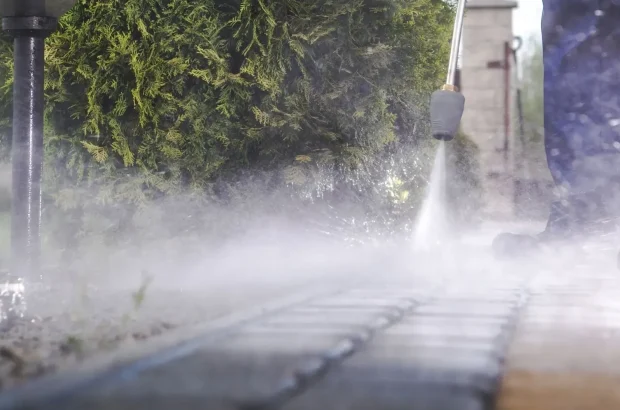 Pressure washing service cleaning exterior surfaces in Roslyn NY